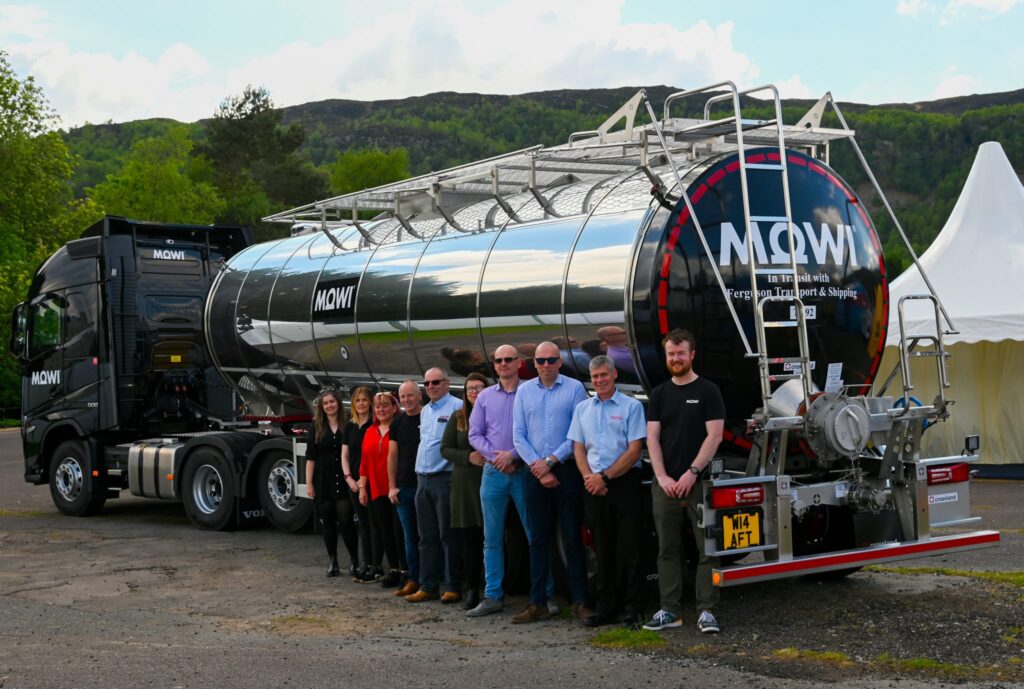 group standing in front of truck