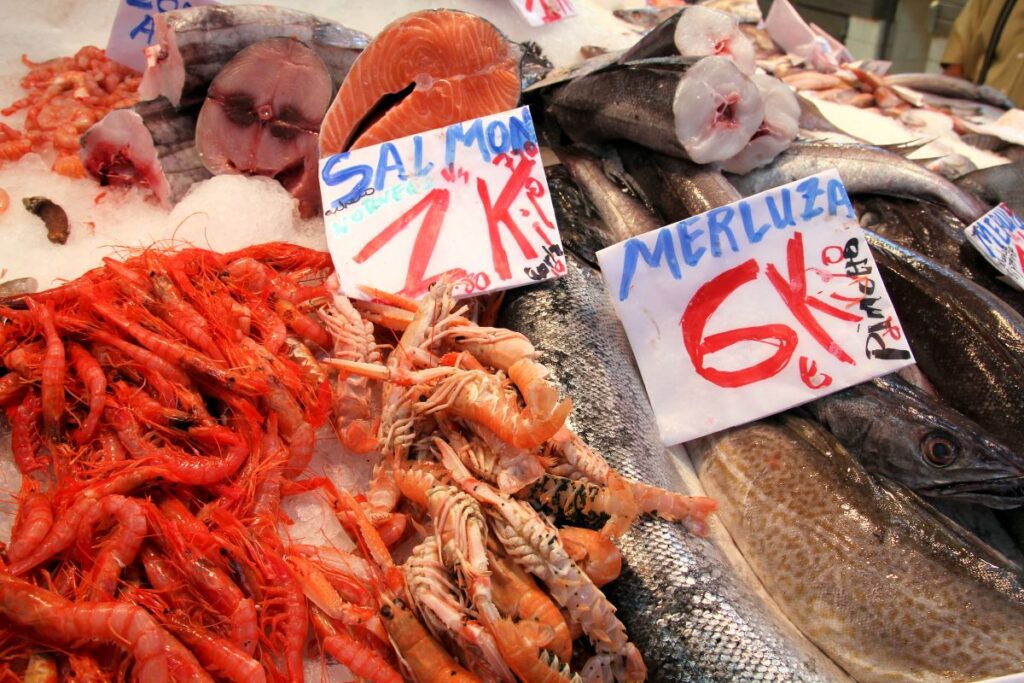 fish and shellfish on counter in market