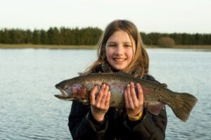 Girl with rainbow trout