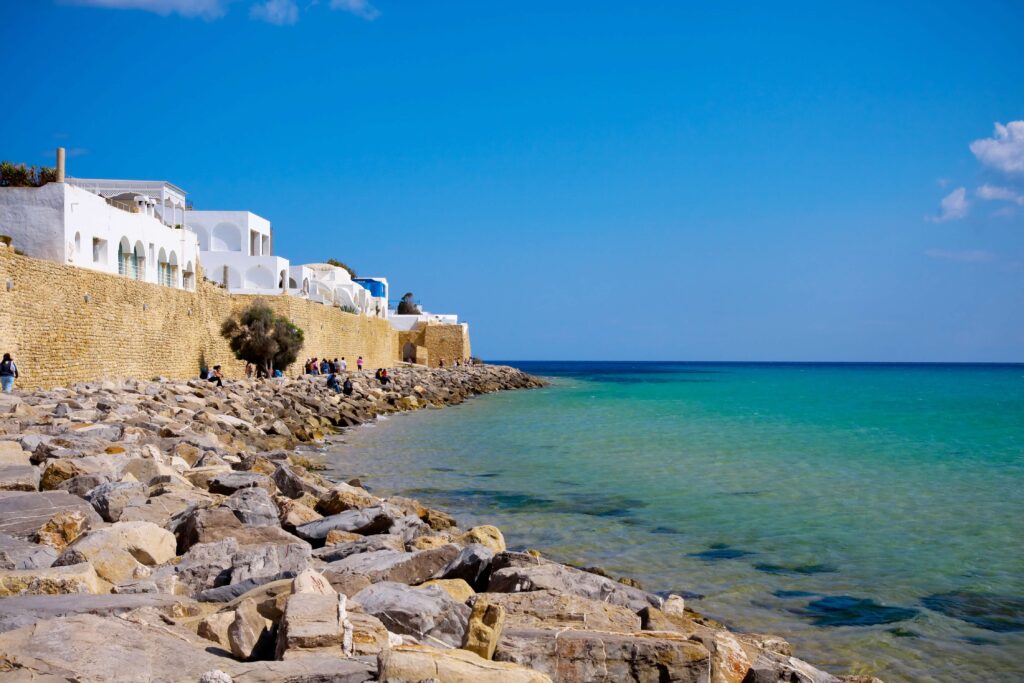 white houses by a blue sea