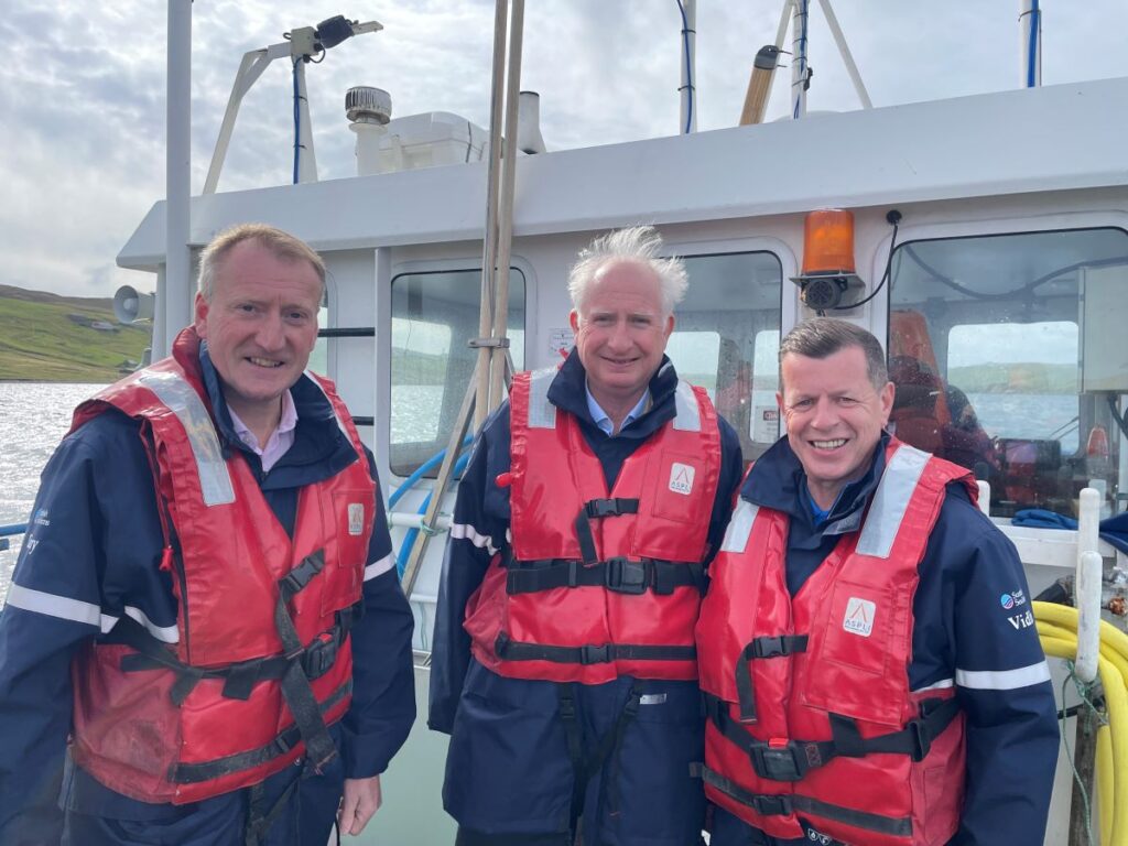 Three men in life jackets