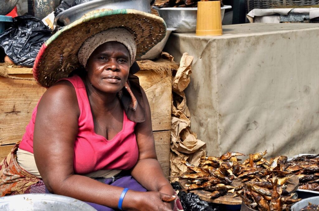 Market woman at her fish stand