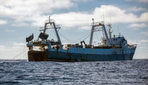 A fishing vessel lifts its trawl tackle off the coast of Africa