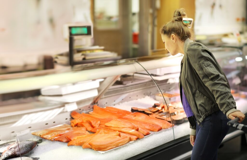 Shopper at fish counter