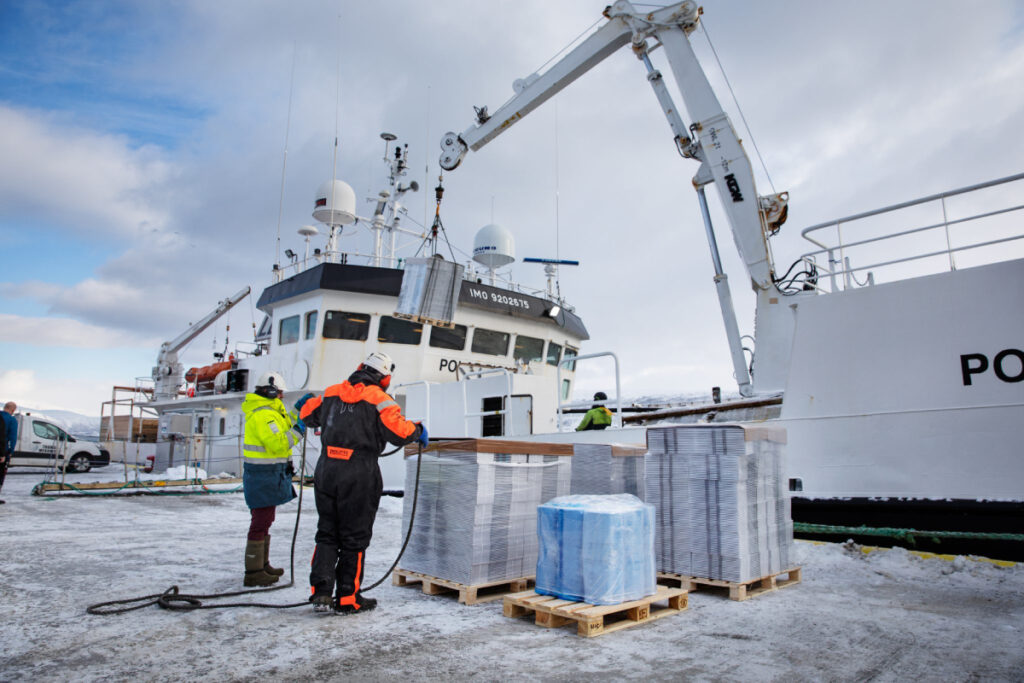 Fishing vessel with crane and fish boxes