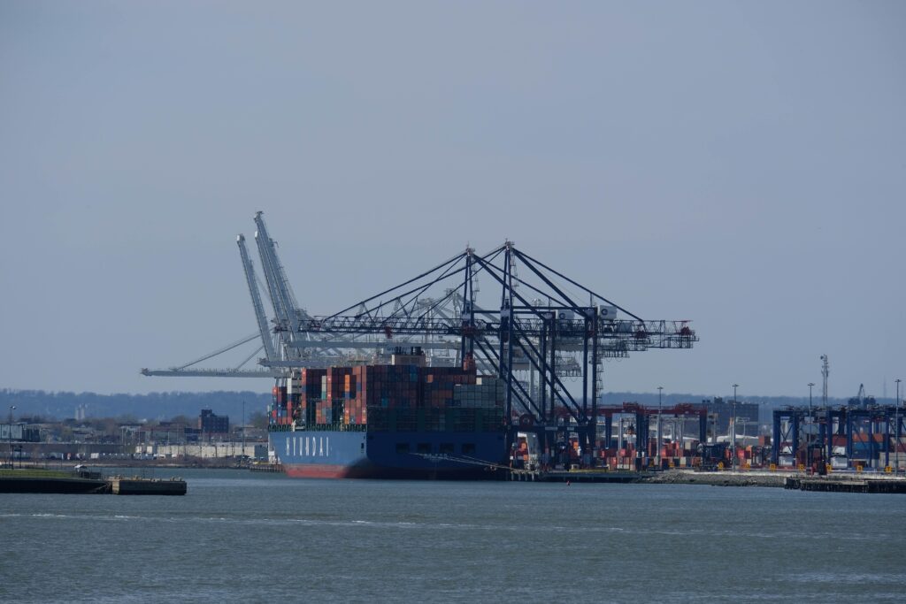 ship moored at dock, with cranes