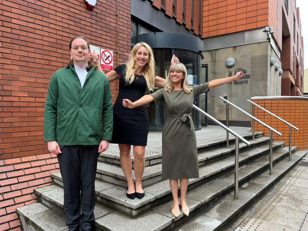 Abigail Penny, Executive Director, Animal Equality (right) celebrates outside the court with colleagues after permission to appeal the planning decision is granted