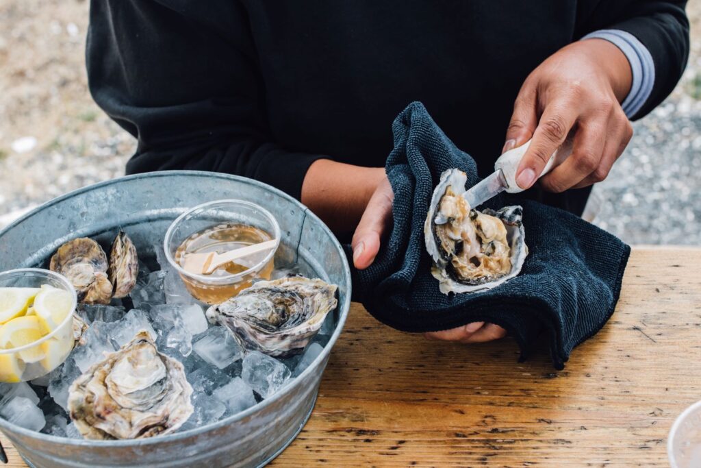 Shucking oysters